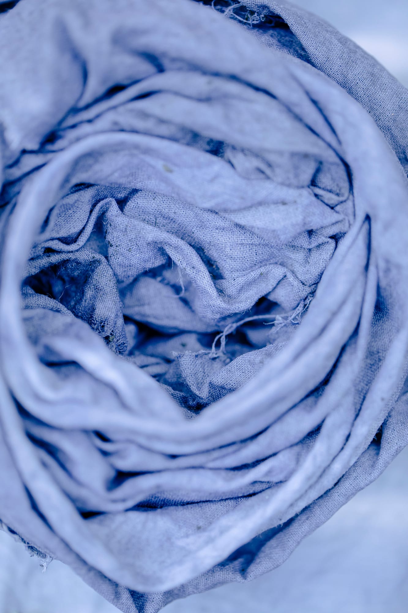 Rolls of dyed textile fabric in saturated colour