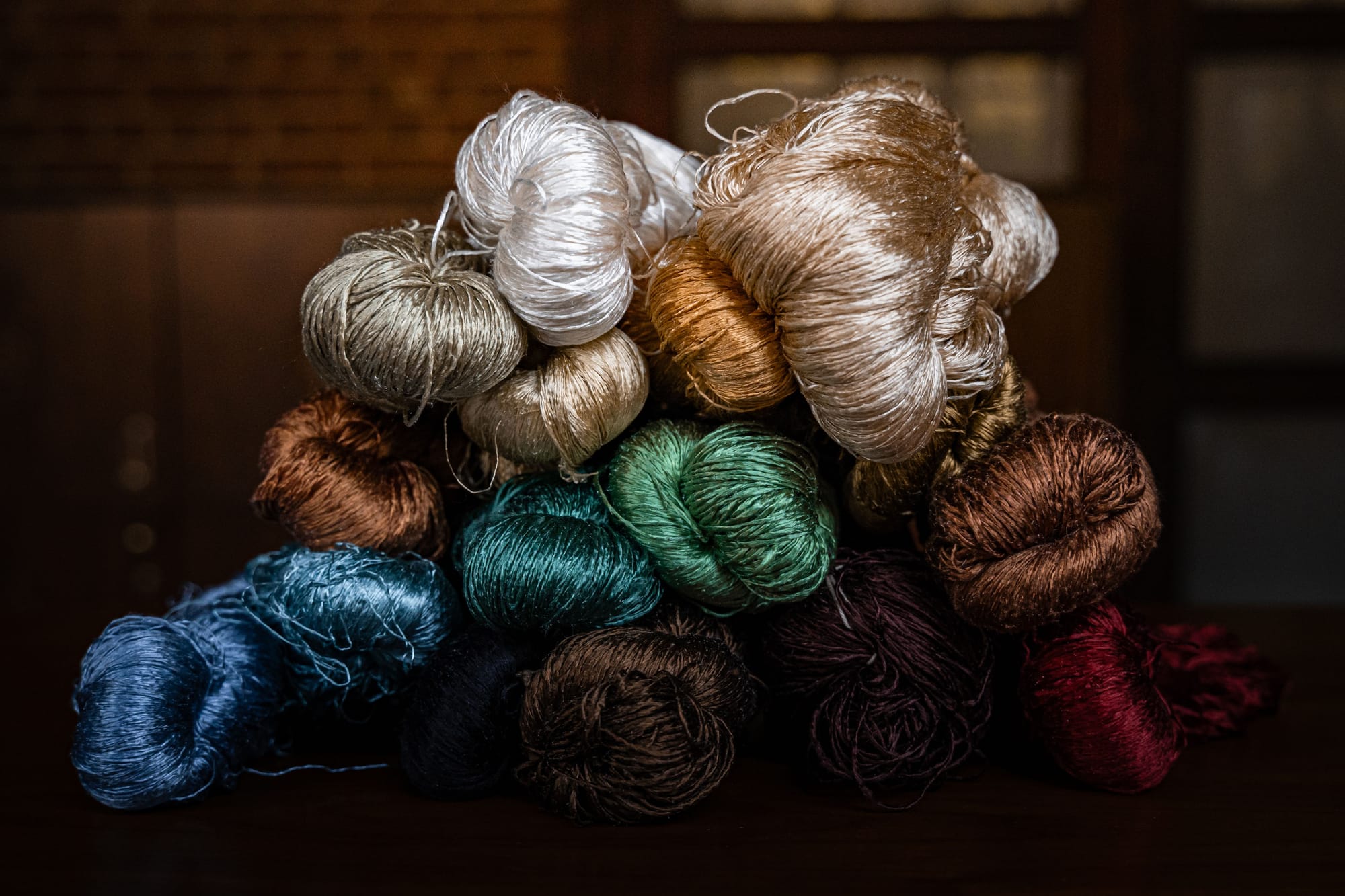 Bundles of dyed silk yarn in saturated colour